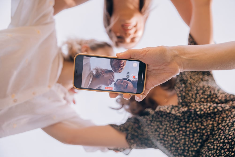 Friends Taking a Photo Using Smartphone